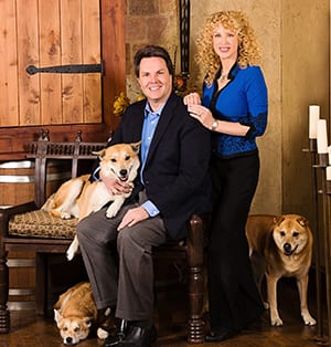 Dr. Tim and Fiona Wright with their rescue dogs (Suki, Dax, and Austin)